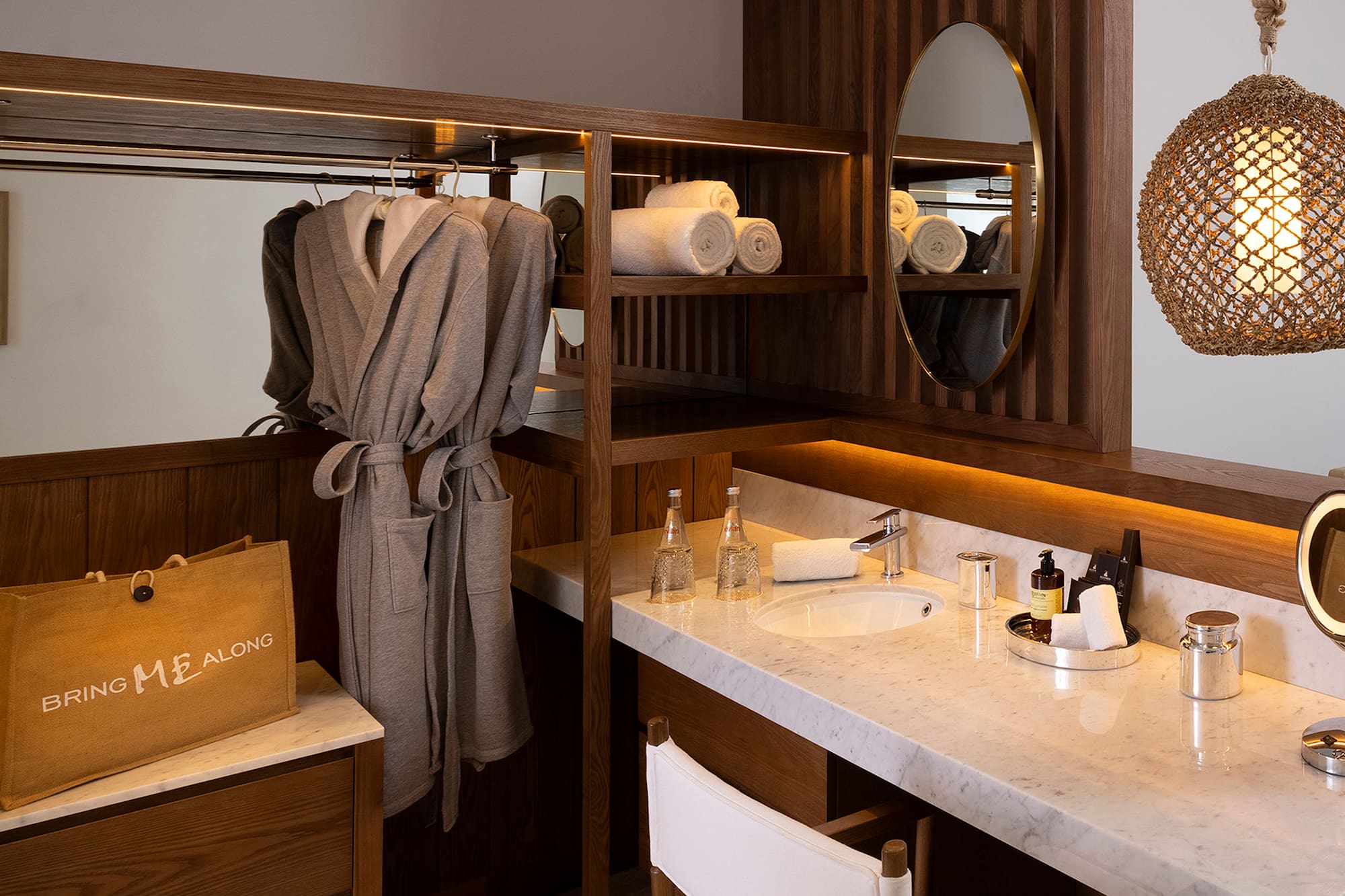 a bathroom with a mirror and towels