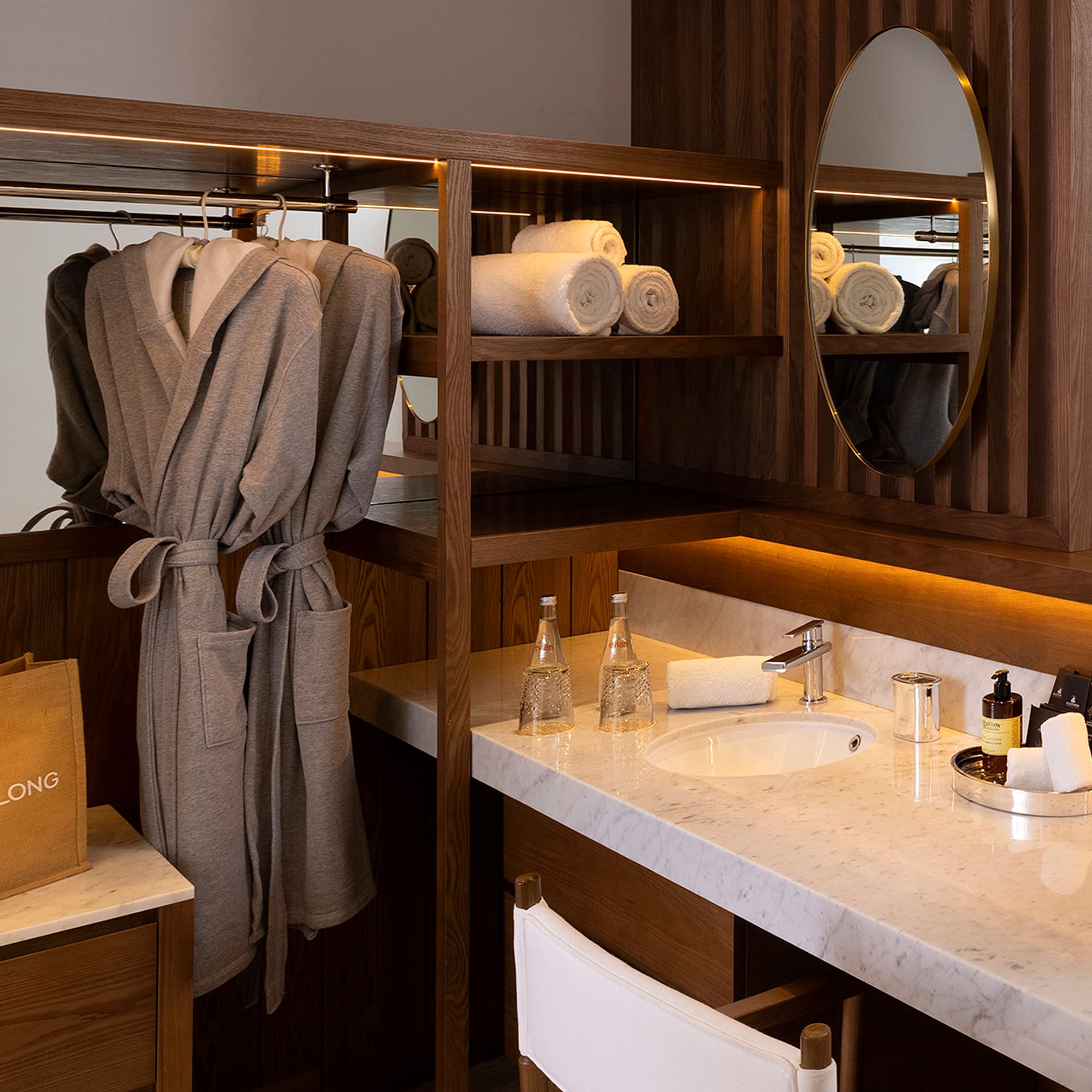 a bathroom with a mirror and towels