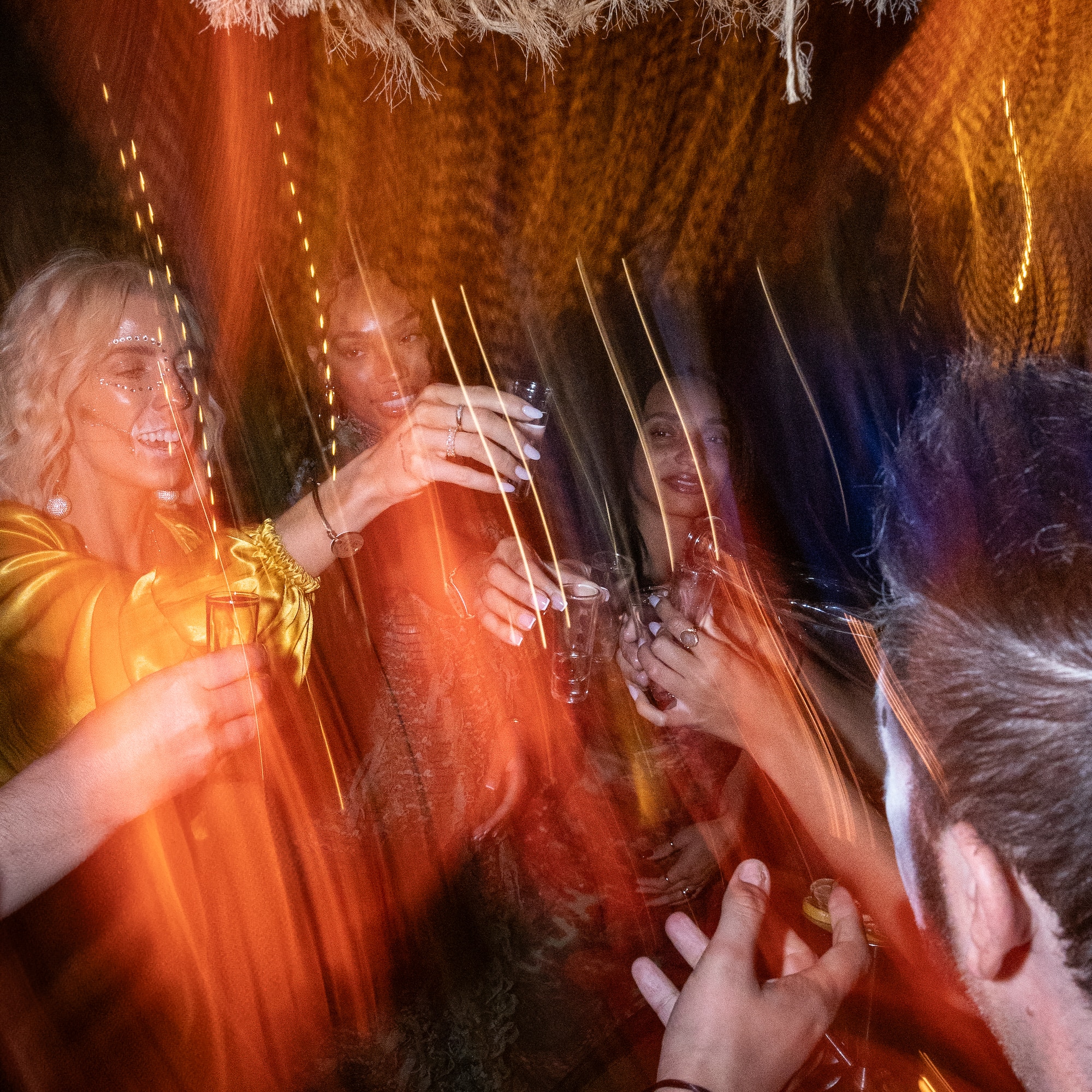 a group of people holding glasses