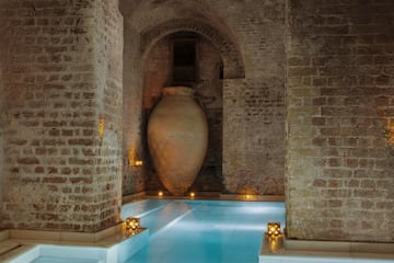 a large vase in a pool