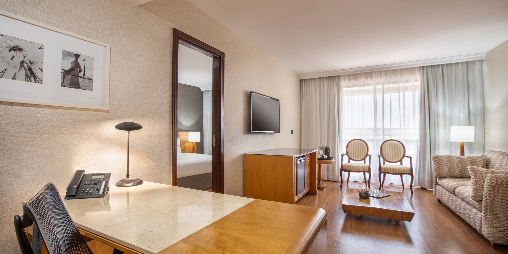 a room with a desk and a television