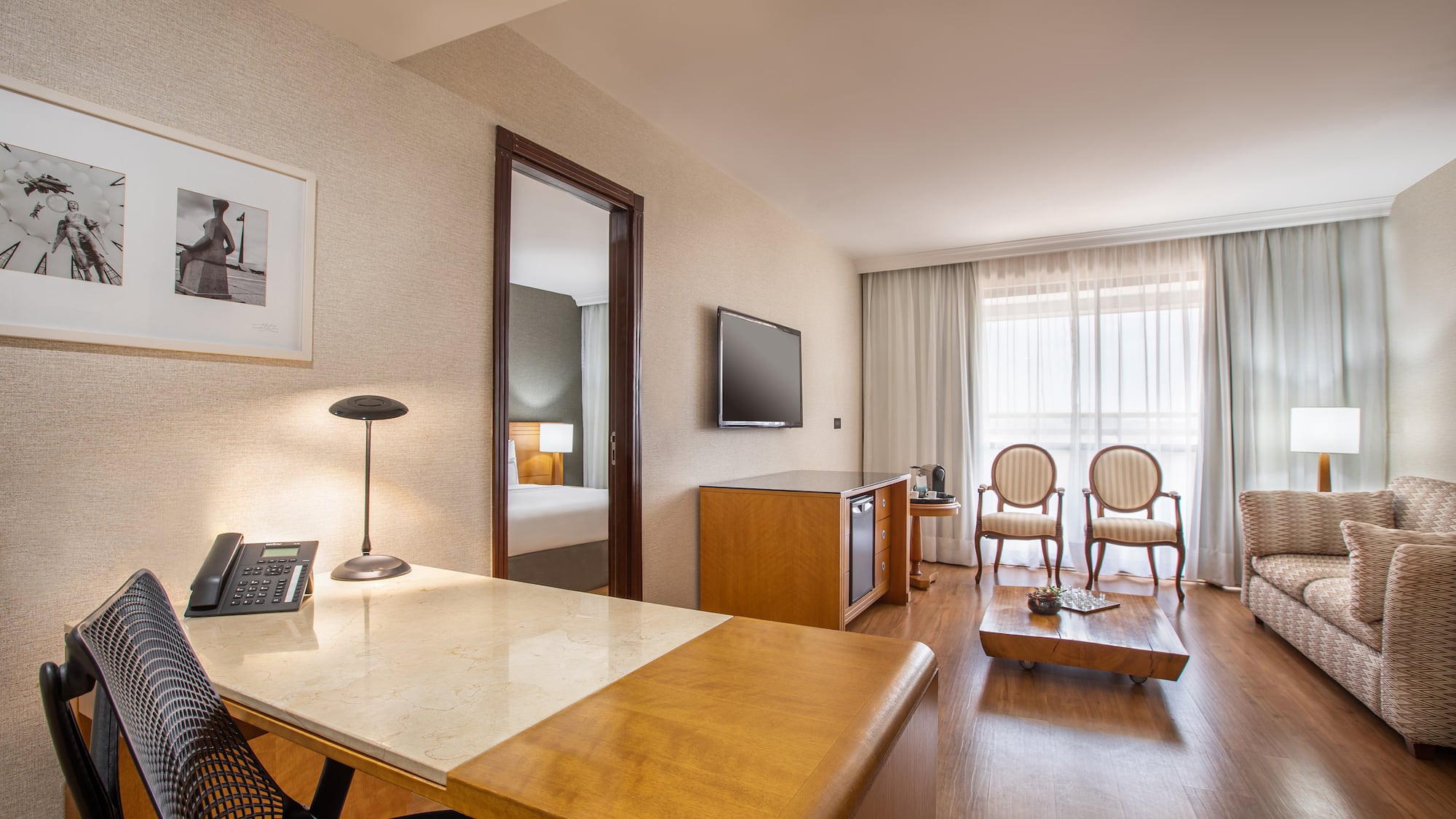 a room with a desk and a television