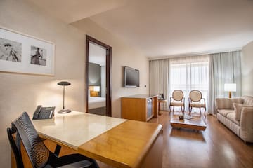 a room with a desk and a television