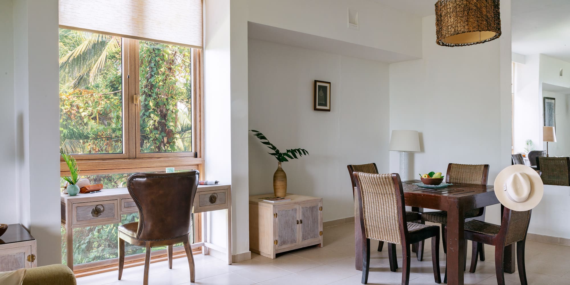 a dining room with a table and chairs