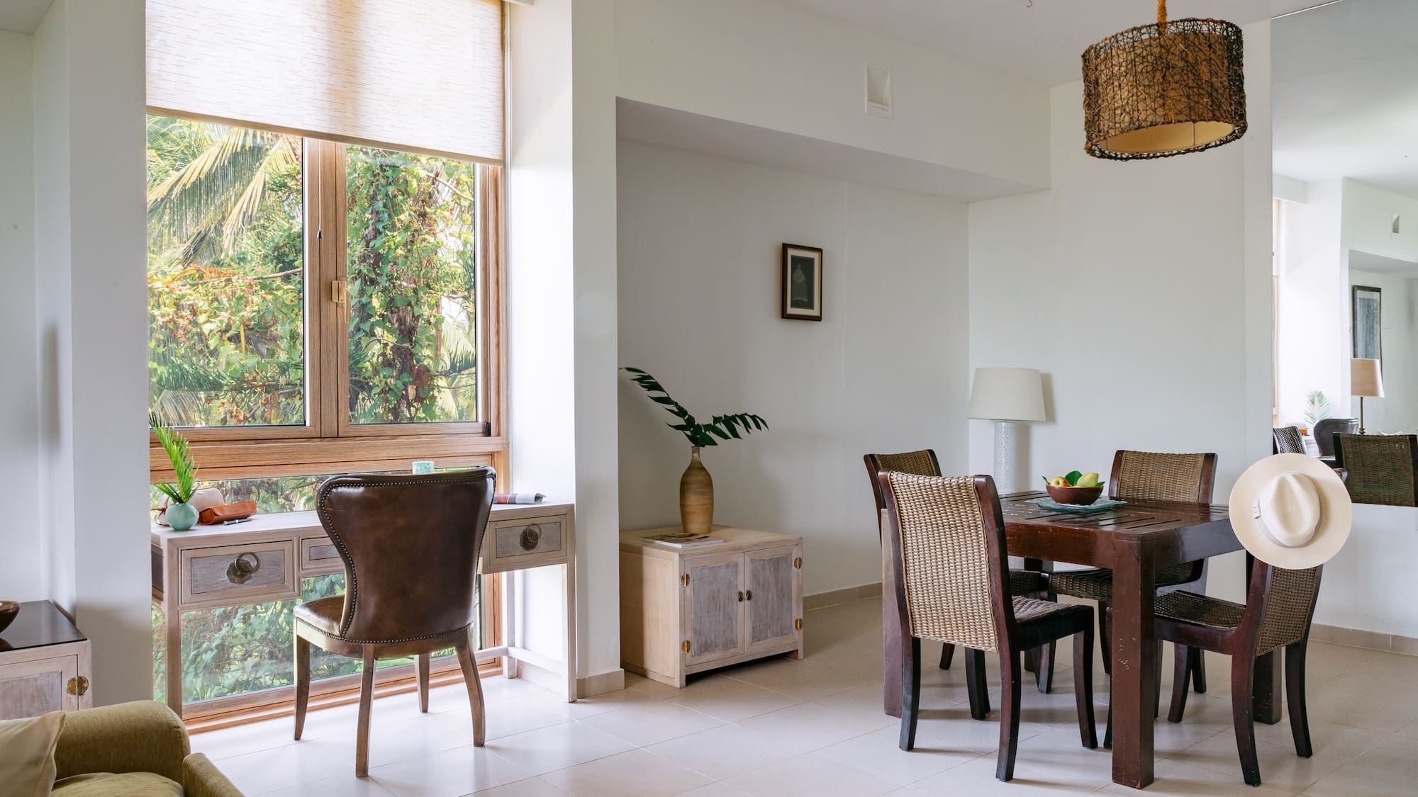 a dining room with a table and chairs
