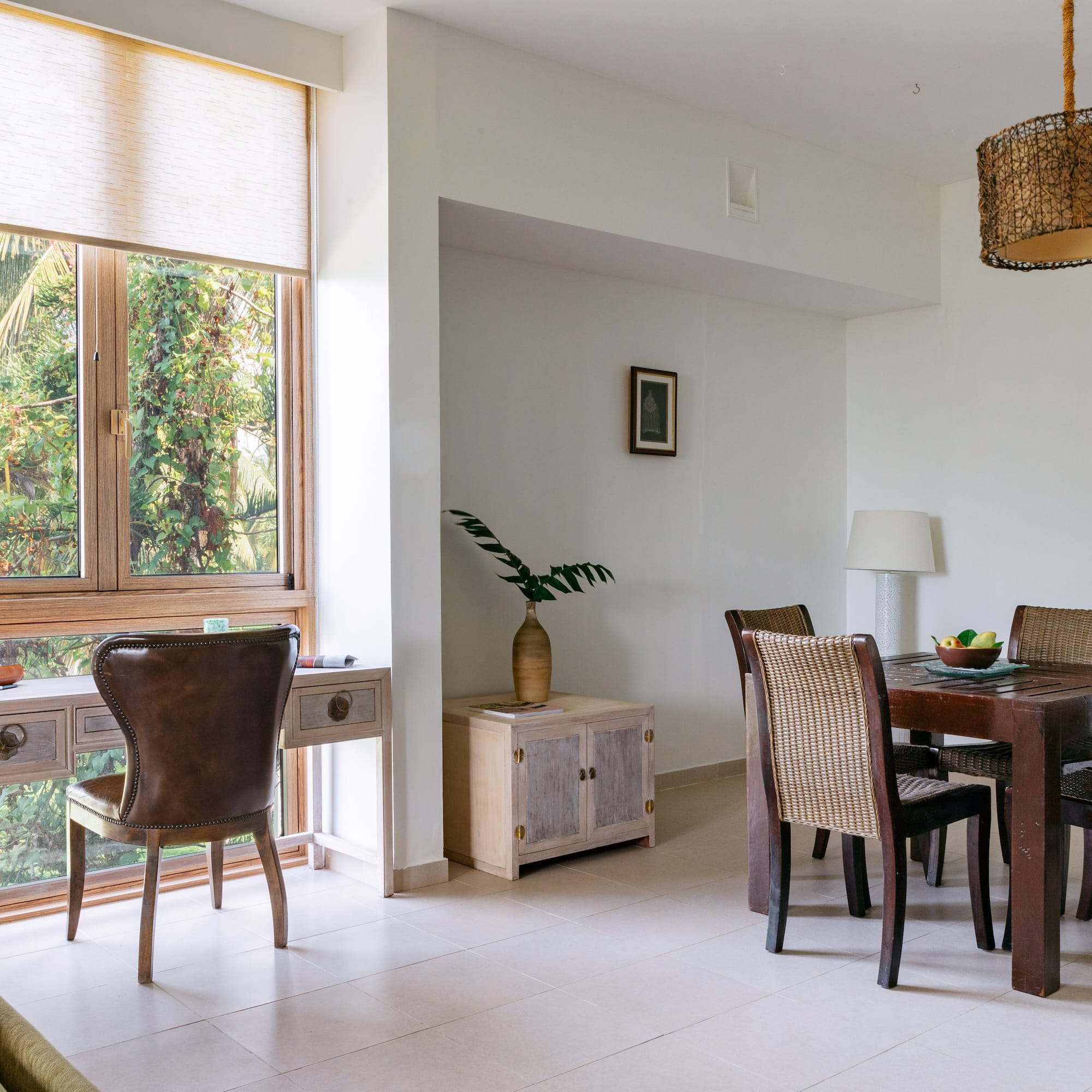 a dining room with a table and chairs