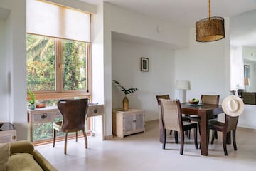 a dining room with a table and chairs