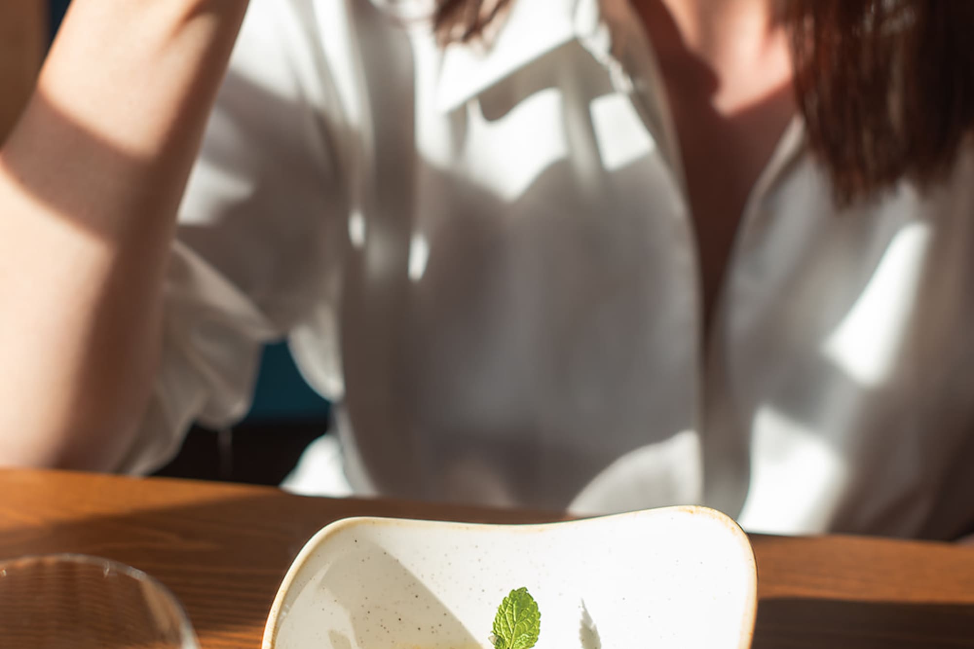 a woman eating a dessert
