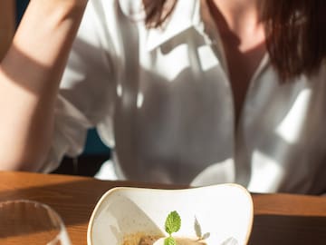 a woman eating a dessert