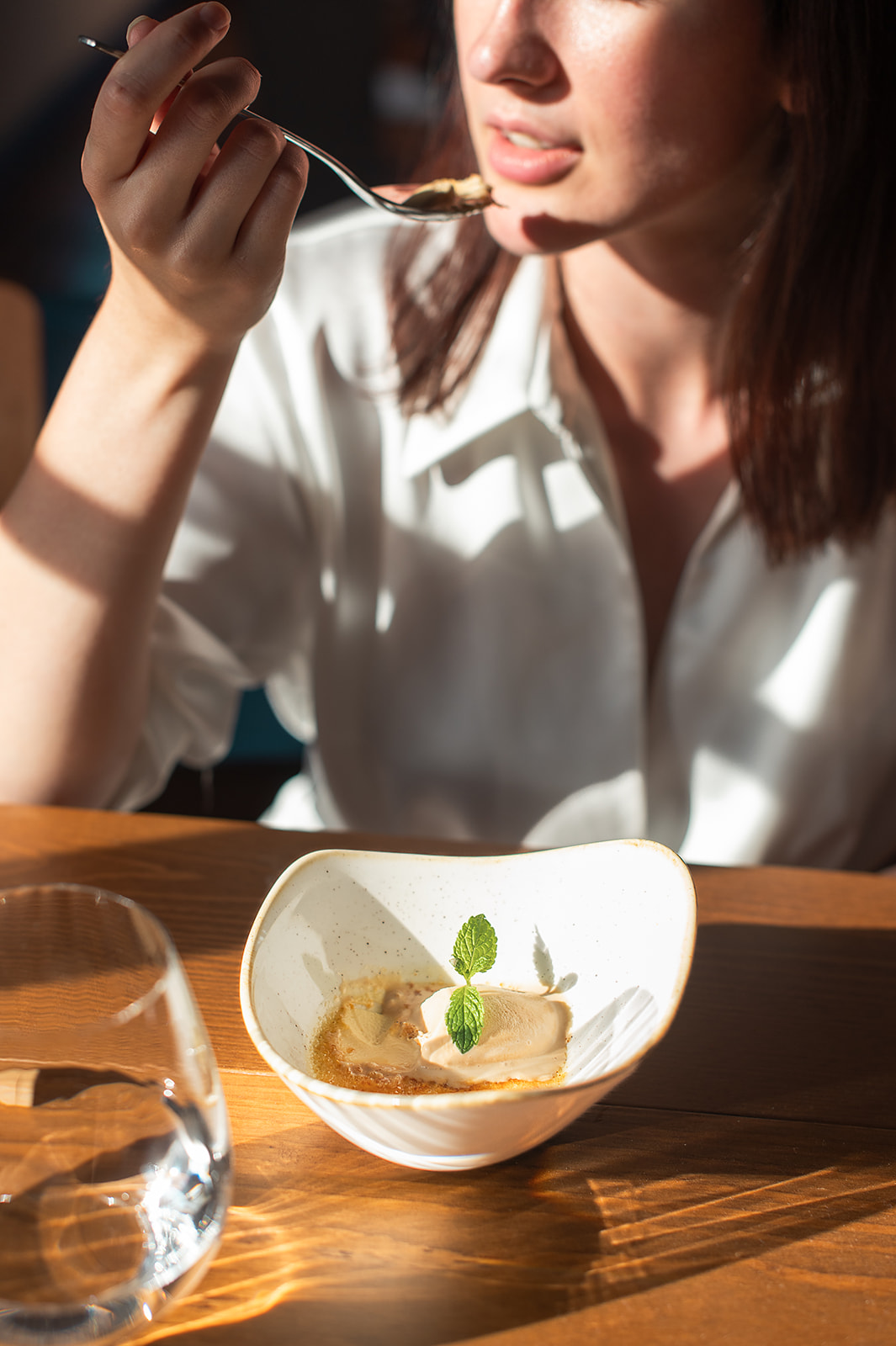a woman eating a dessert