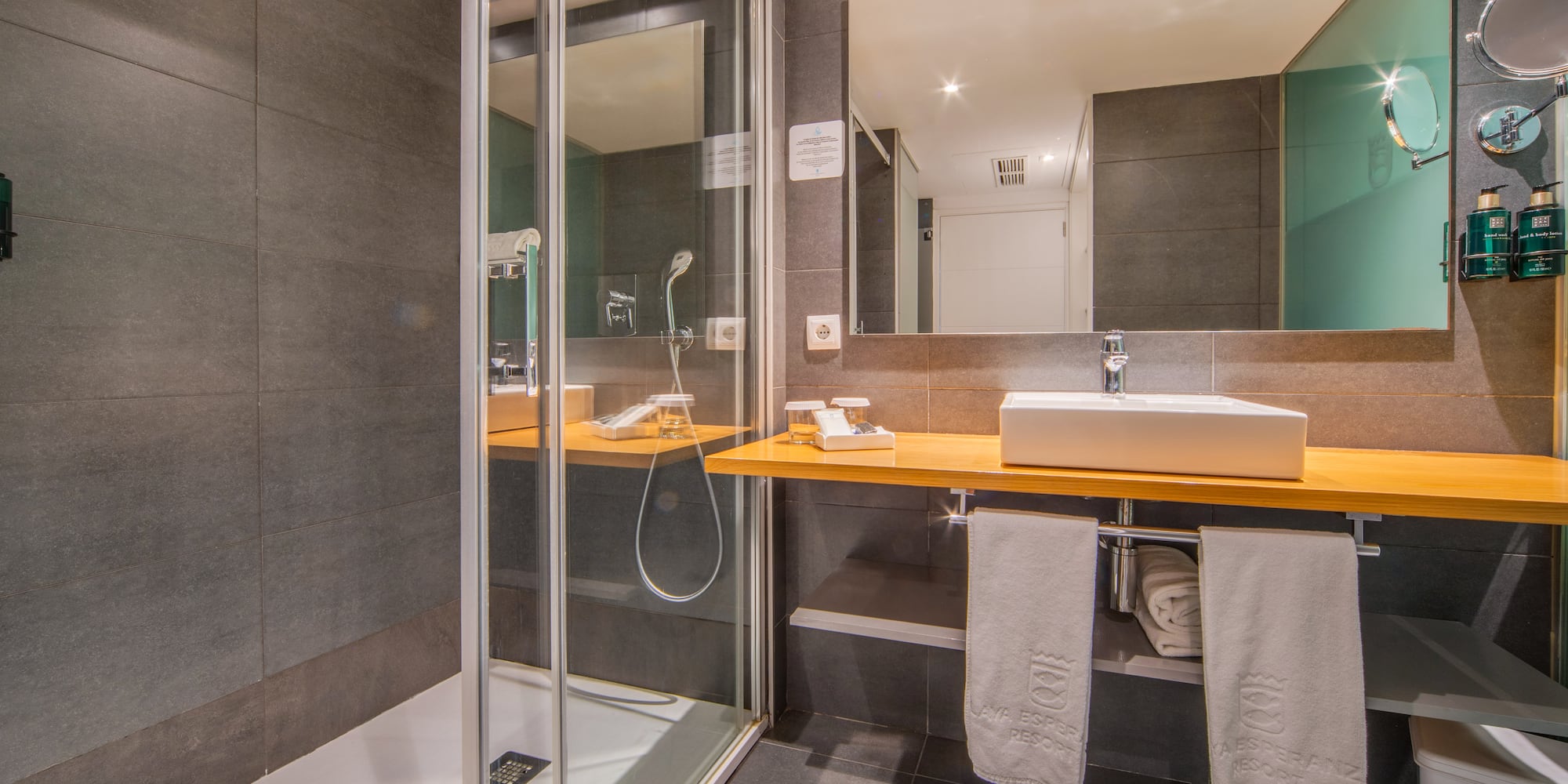 a bathroom with a shower and sink