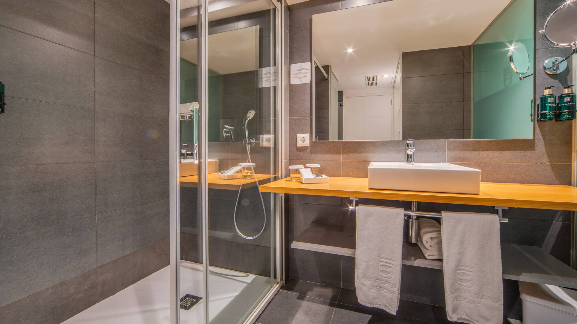 a bathroom with a shower and sink