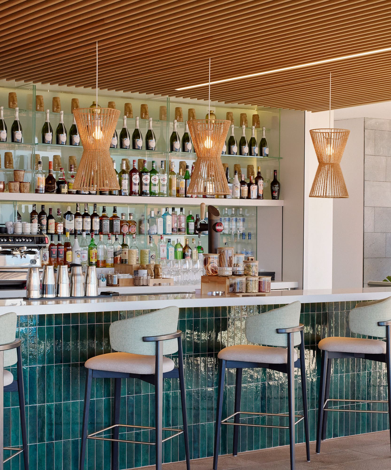 a bar with a counter and chairs