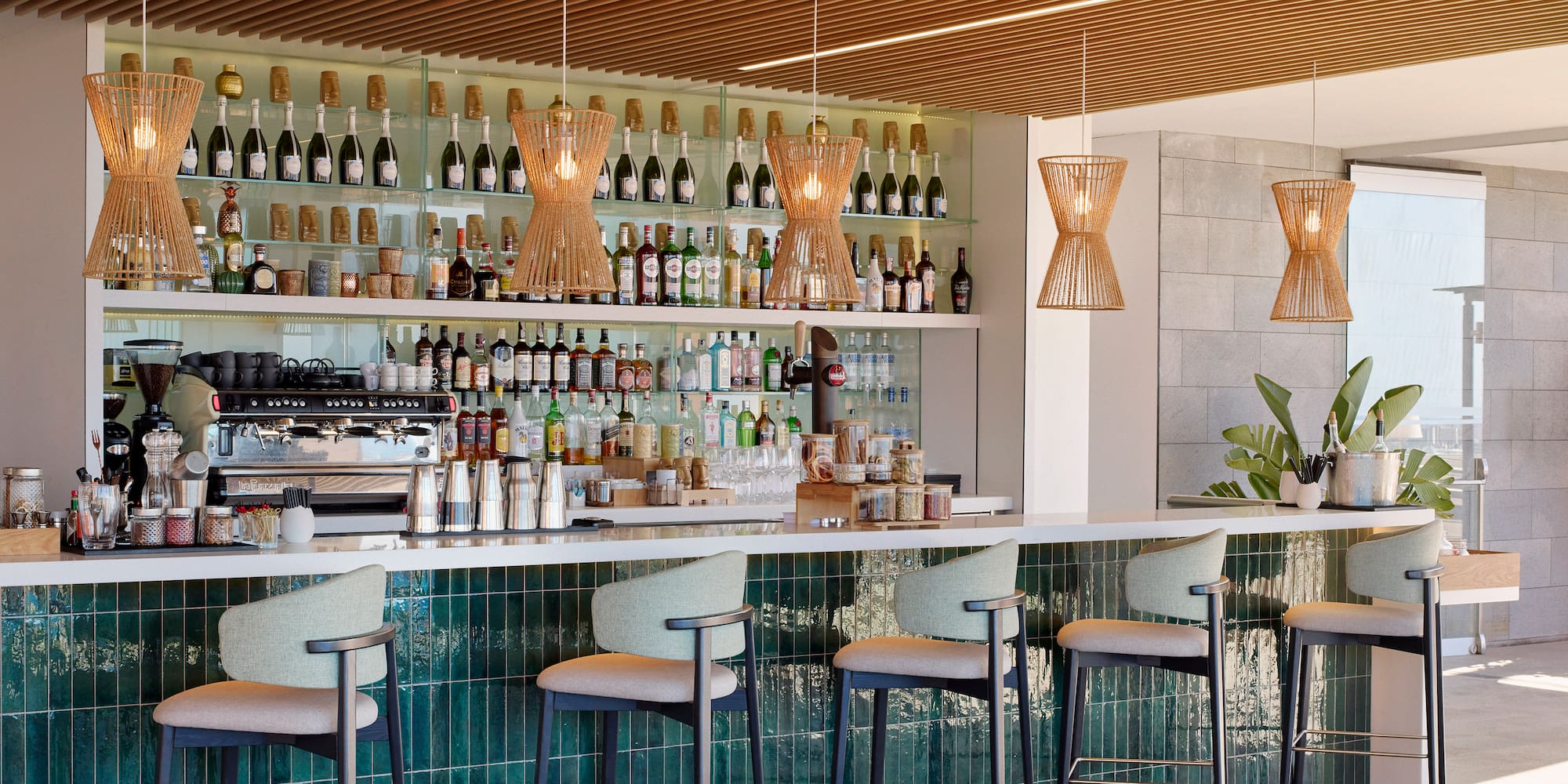 a bar with a counter and chairs