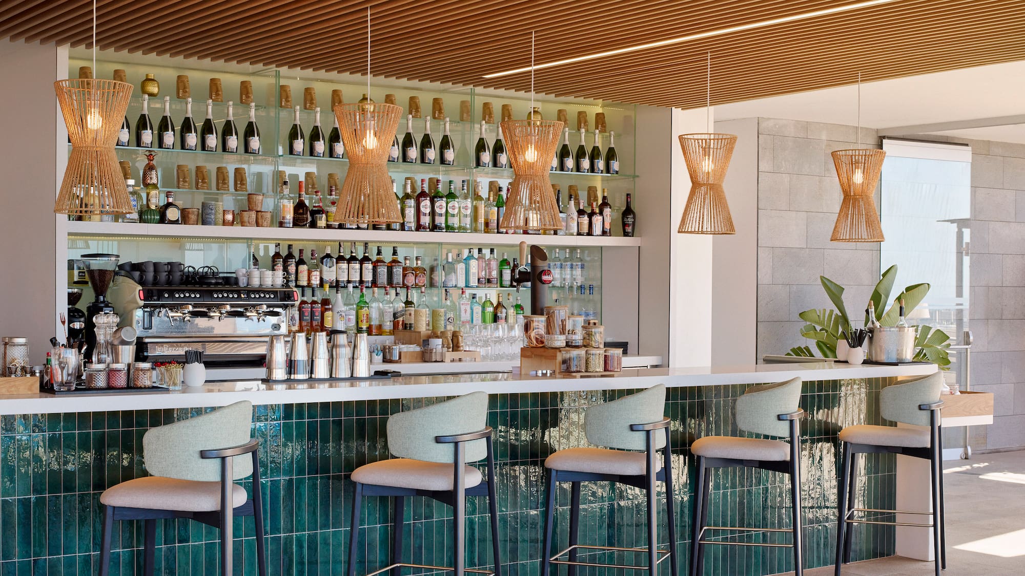 a bar with a counter and chairs