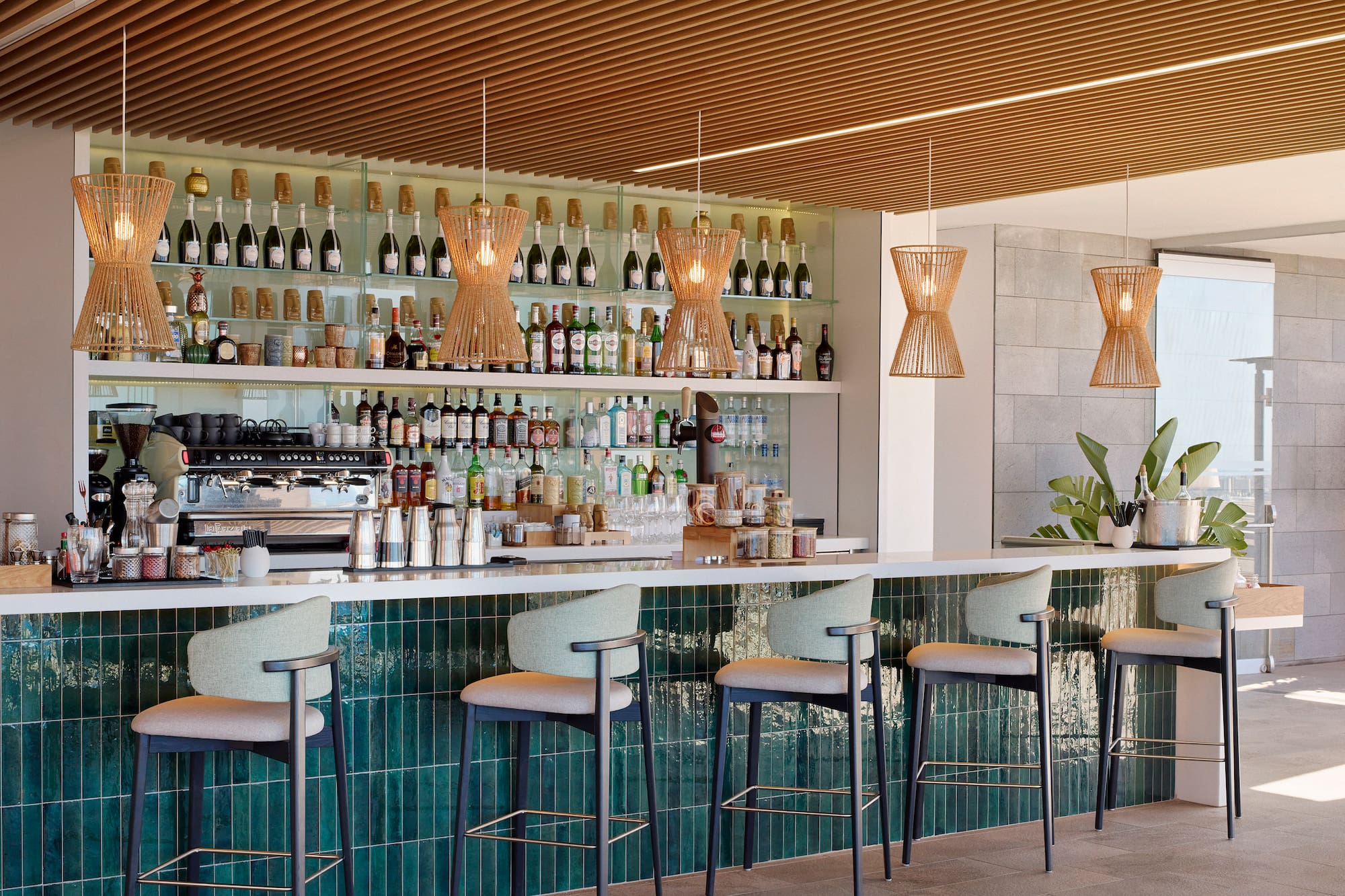 a bar with a counter and chairs