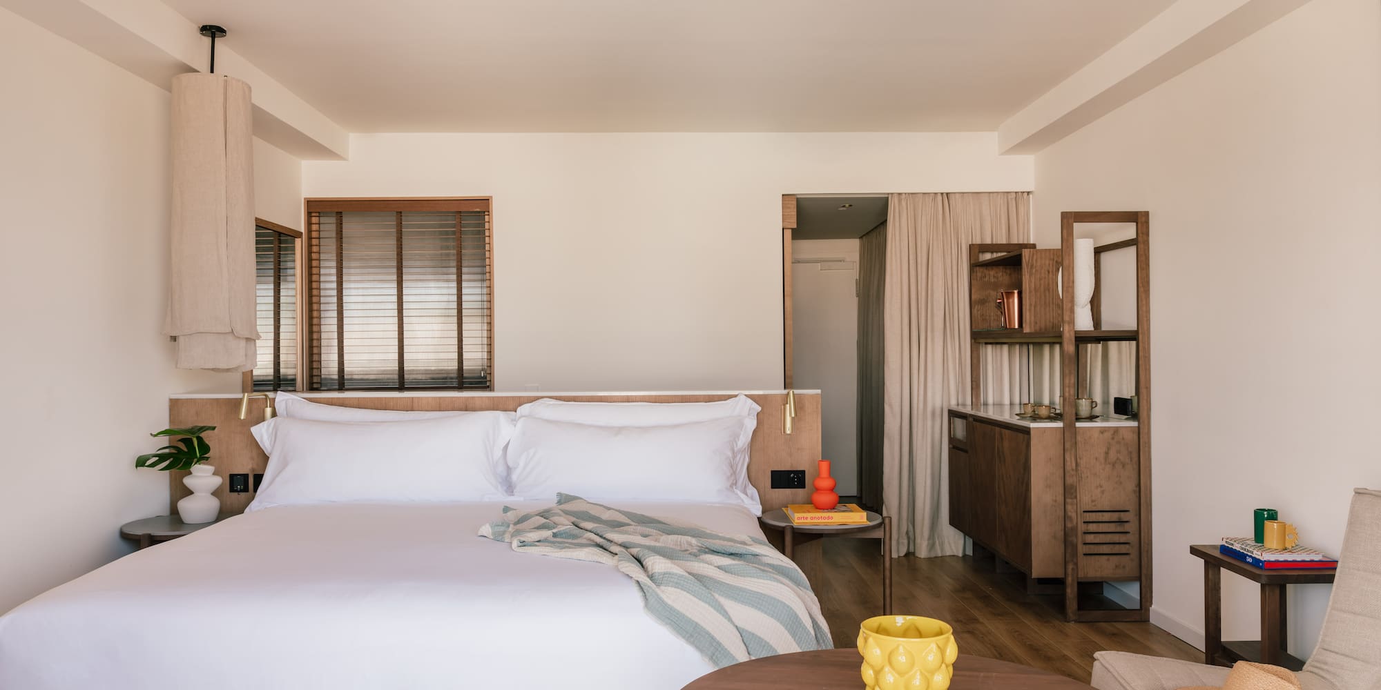 a bedroom with a bed and a table