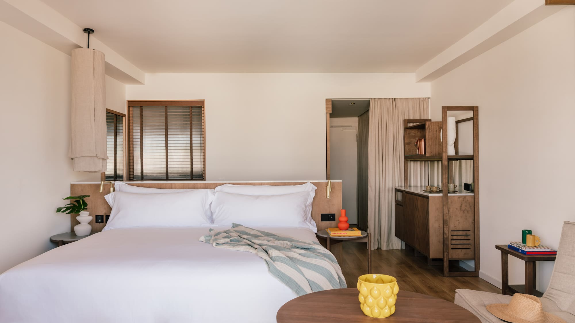 a bedroom with a bed and a table