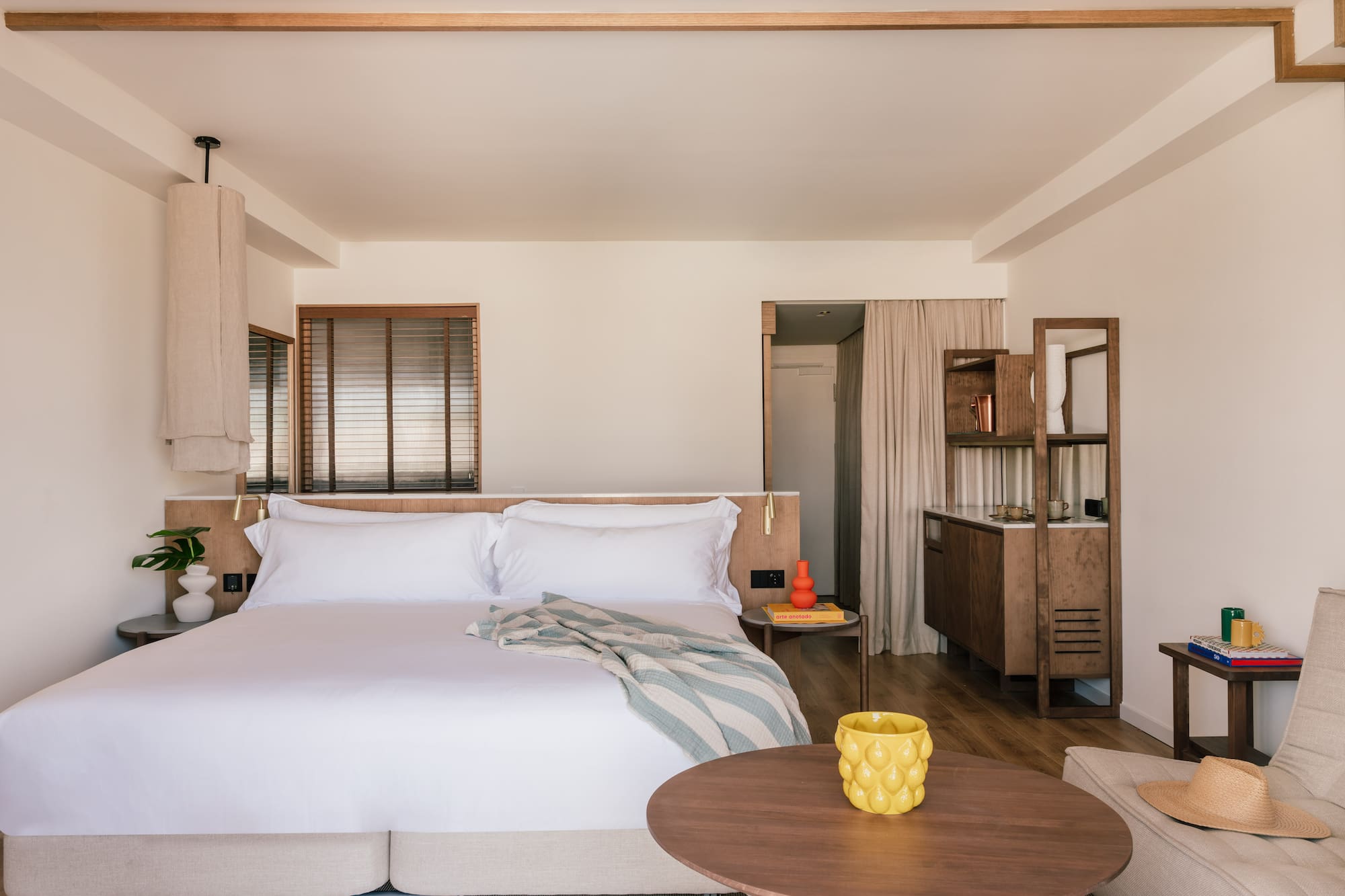 a bedroom with a bed and a table