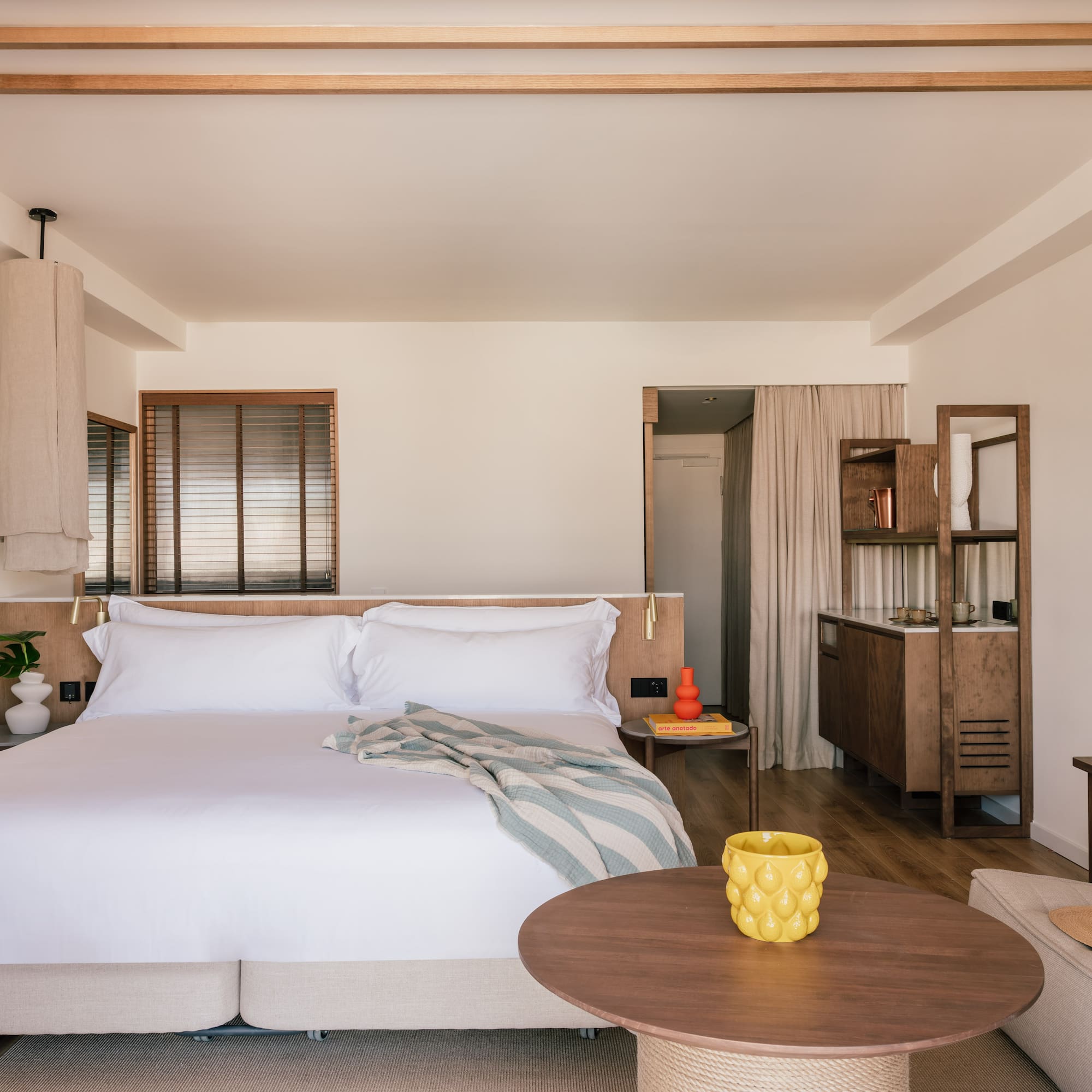 a bedroom with a bed and a table