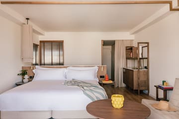 a bedroom with a bed and a table