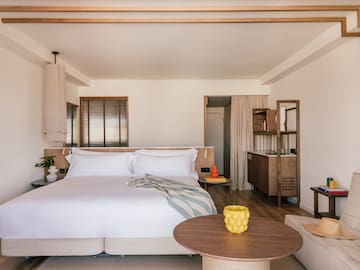 a bedroom with a bed and a table