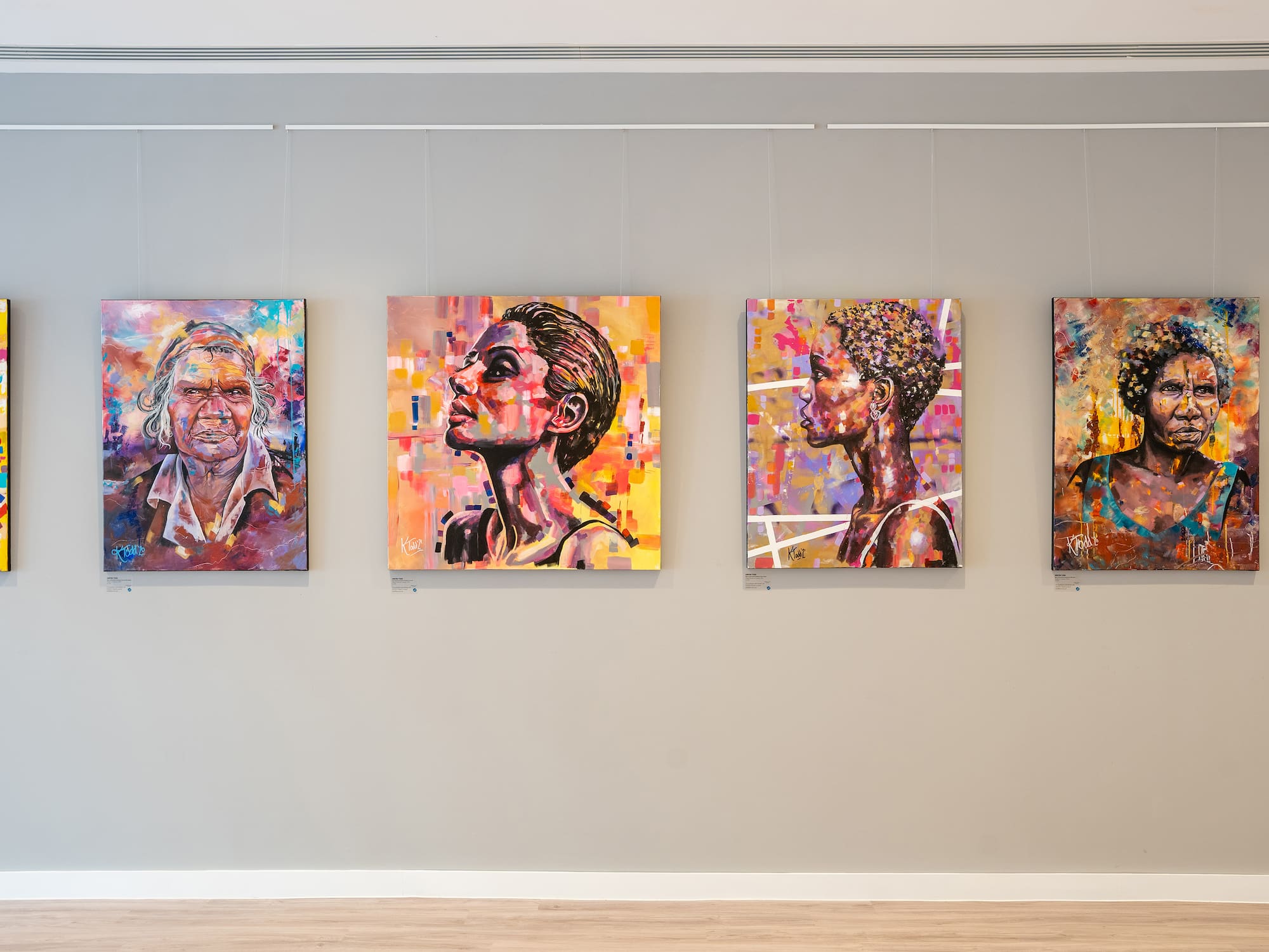 a group of paintings on a wall