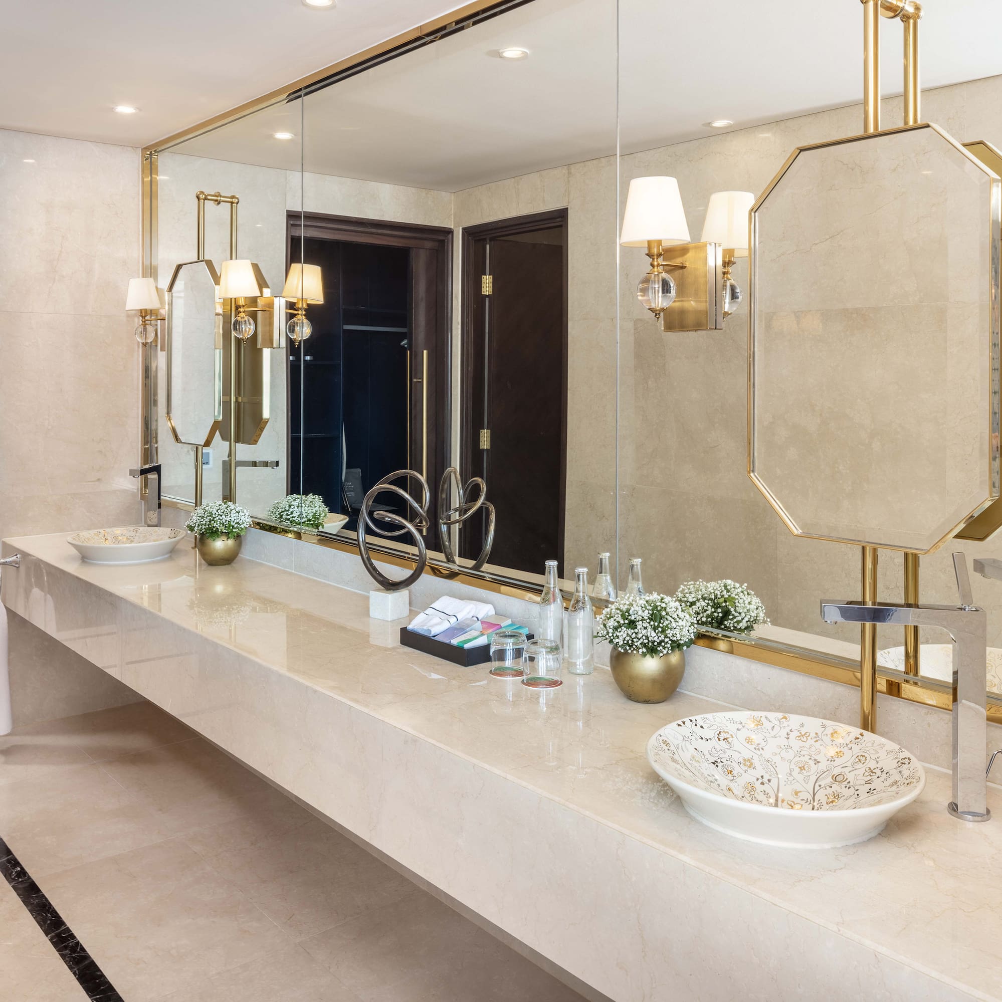 a bathroom with a large mirror and sink