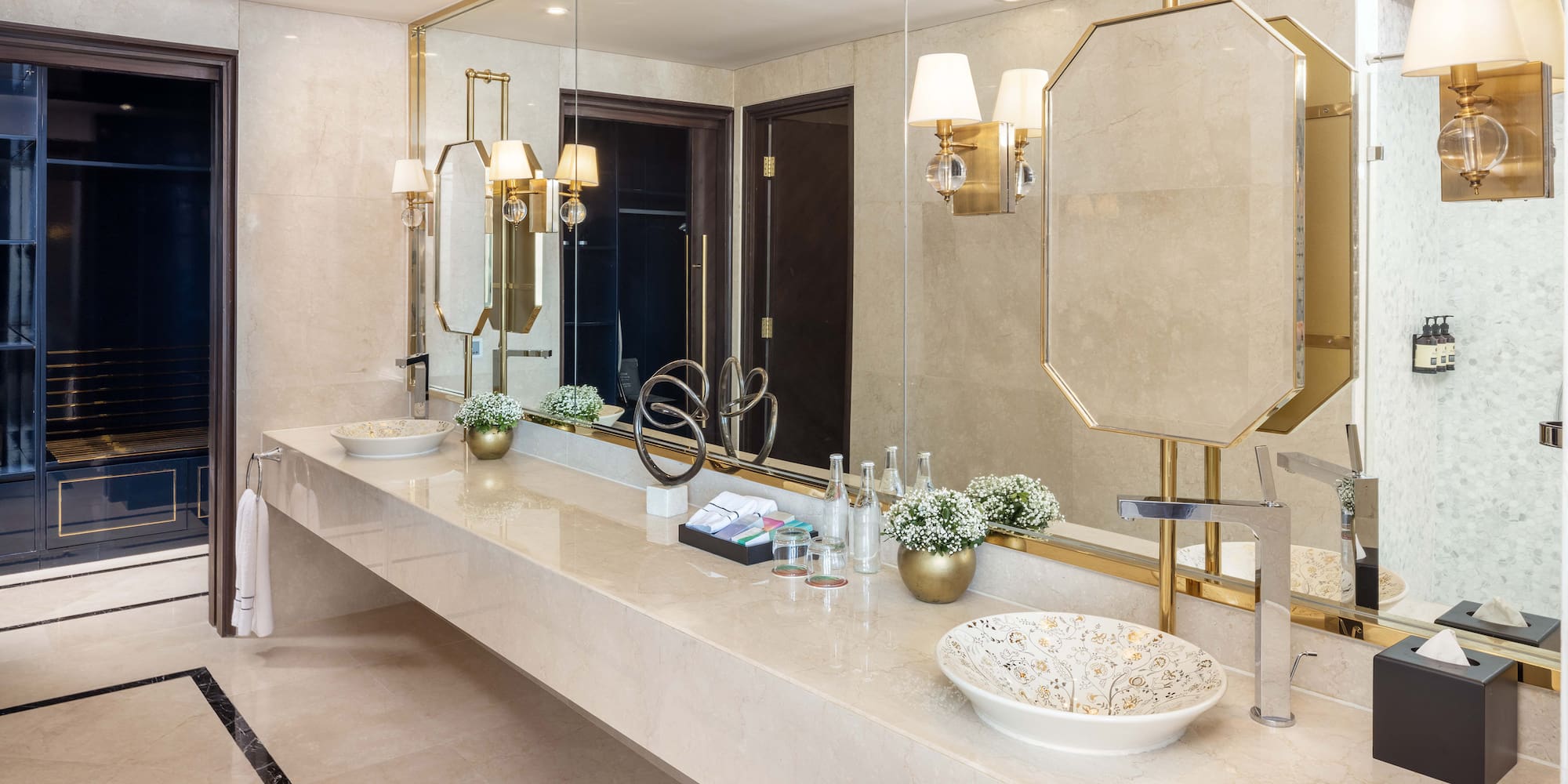 a bathroom with a large mirror and sink