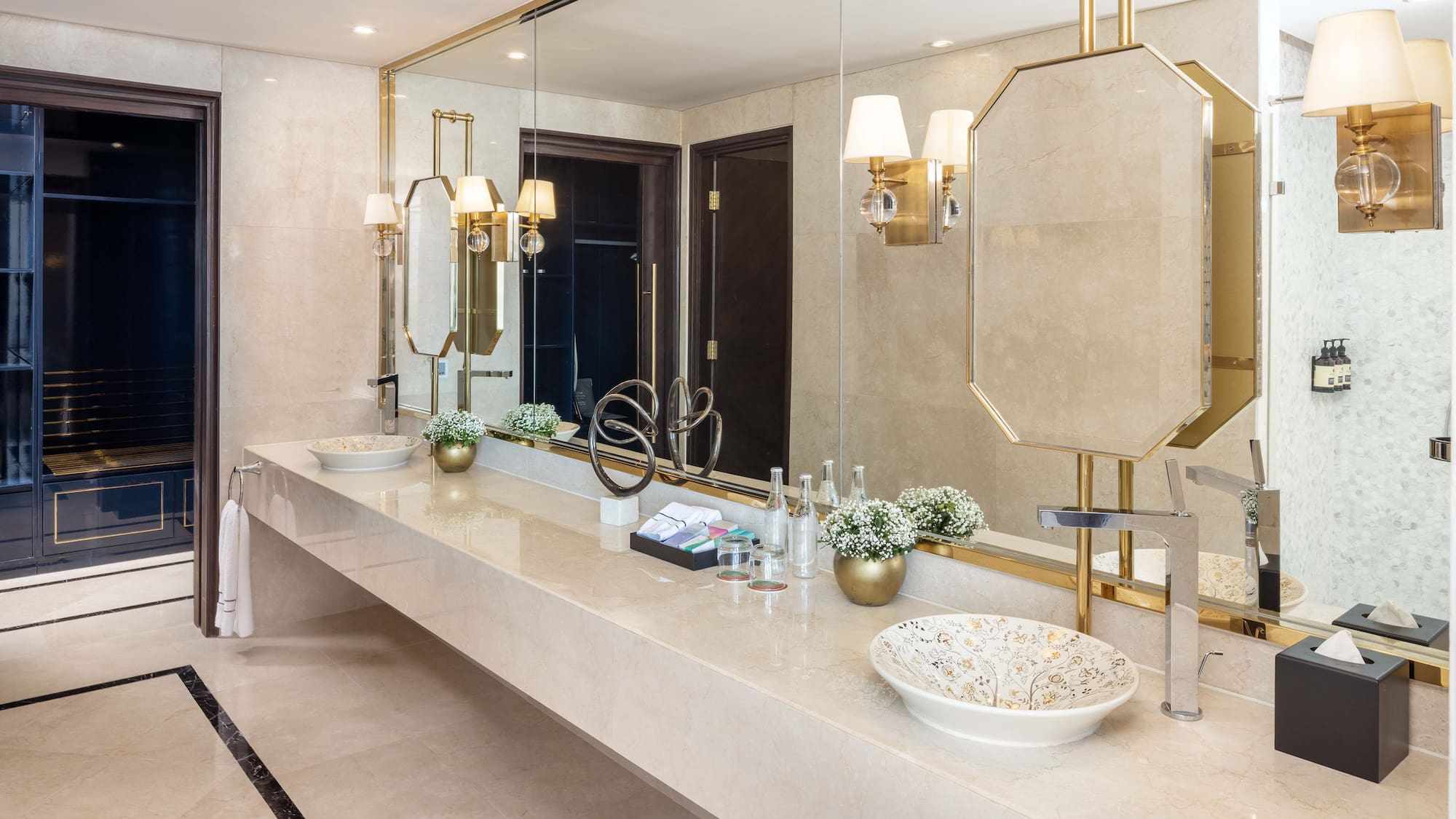 a bathroom with a large mirror and sink