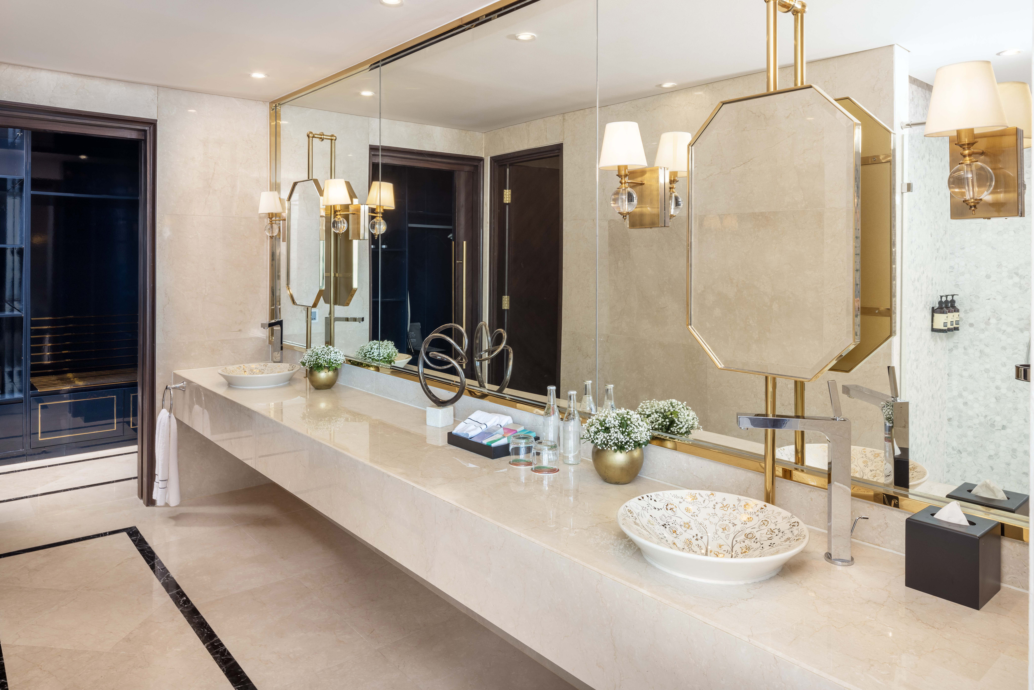a bathroom with a large mirror and sink