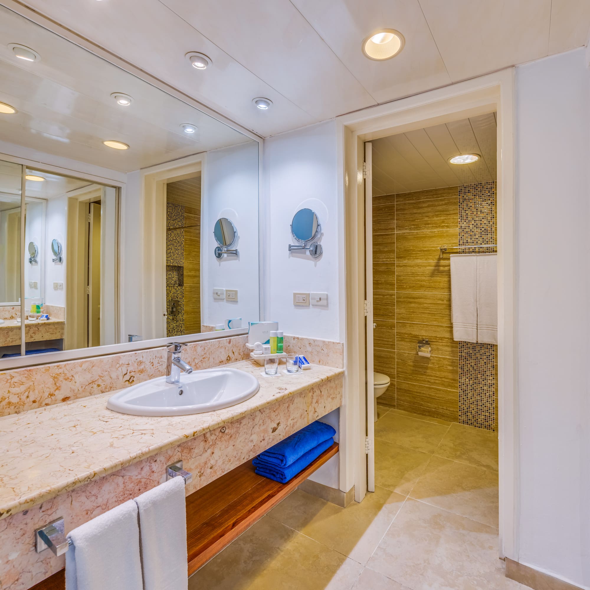 a bathroom with a marble countertop and a shower