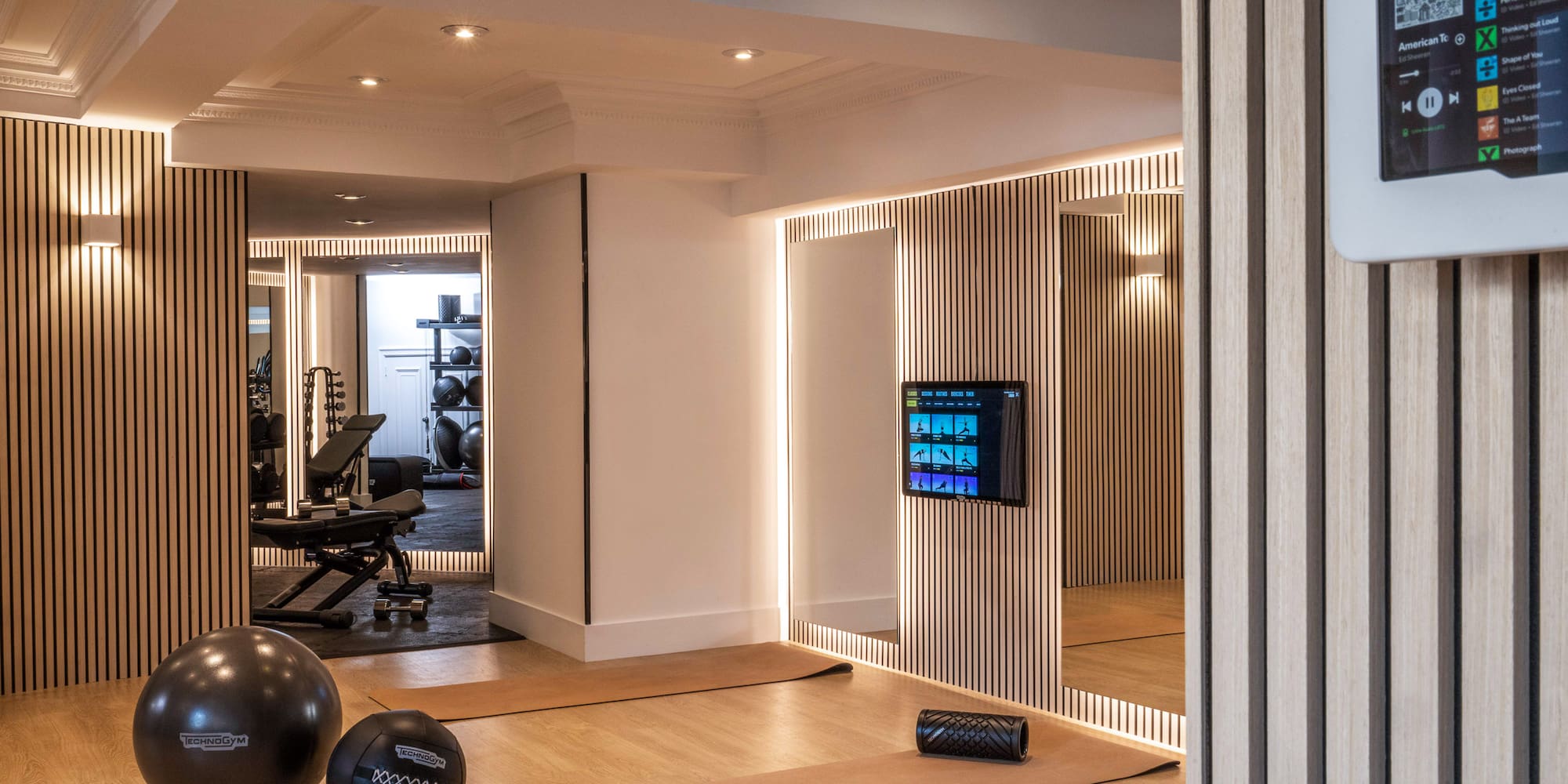 a room with a mirror and exercise equipment