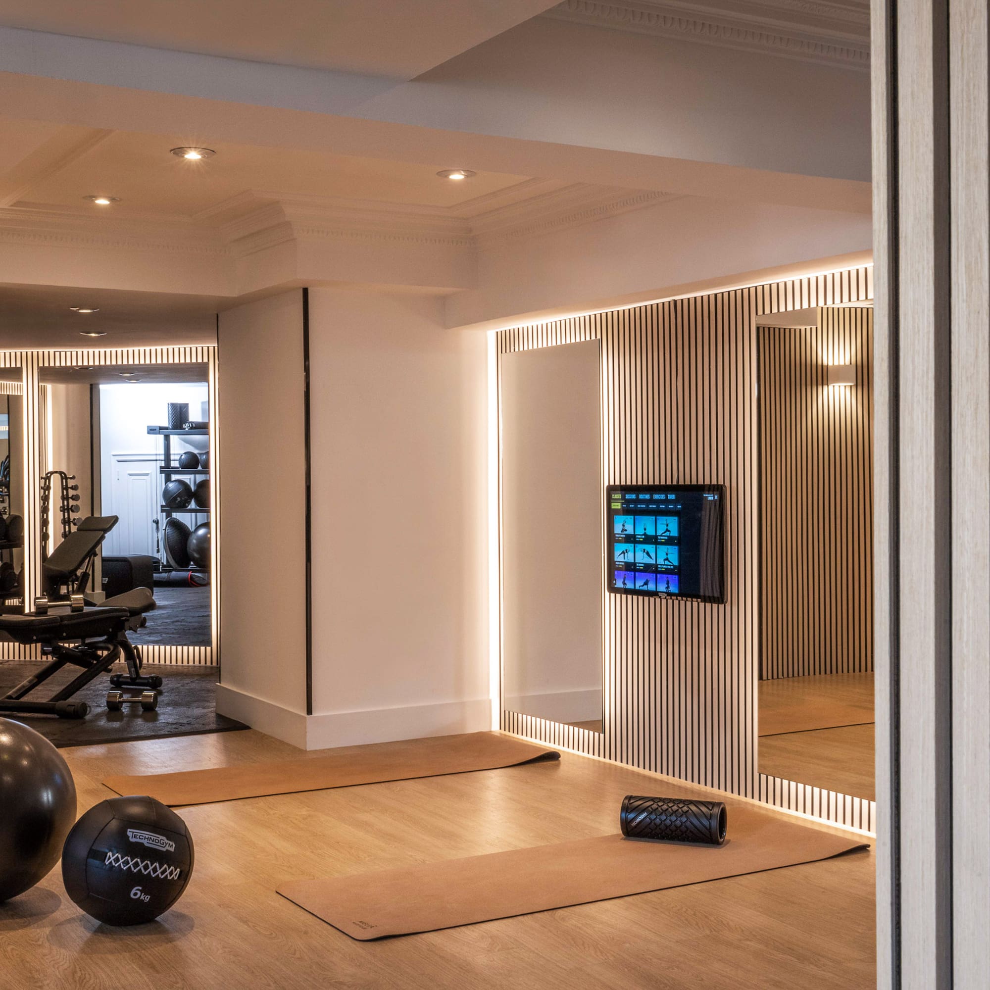 a room with a mirror and exercise equipment