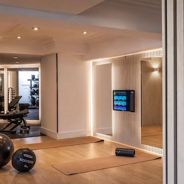 a room with a mirror and exercise equipment