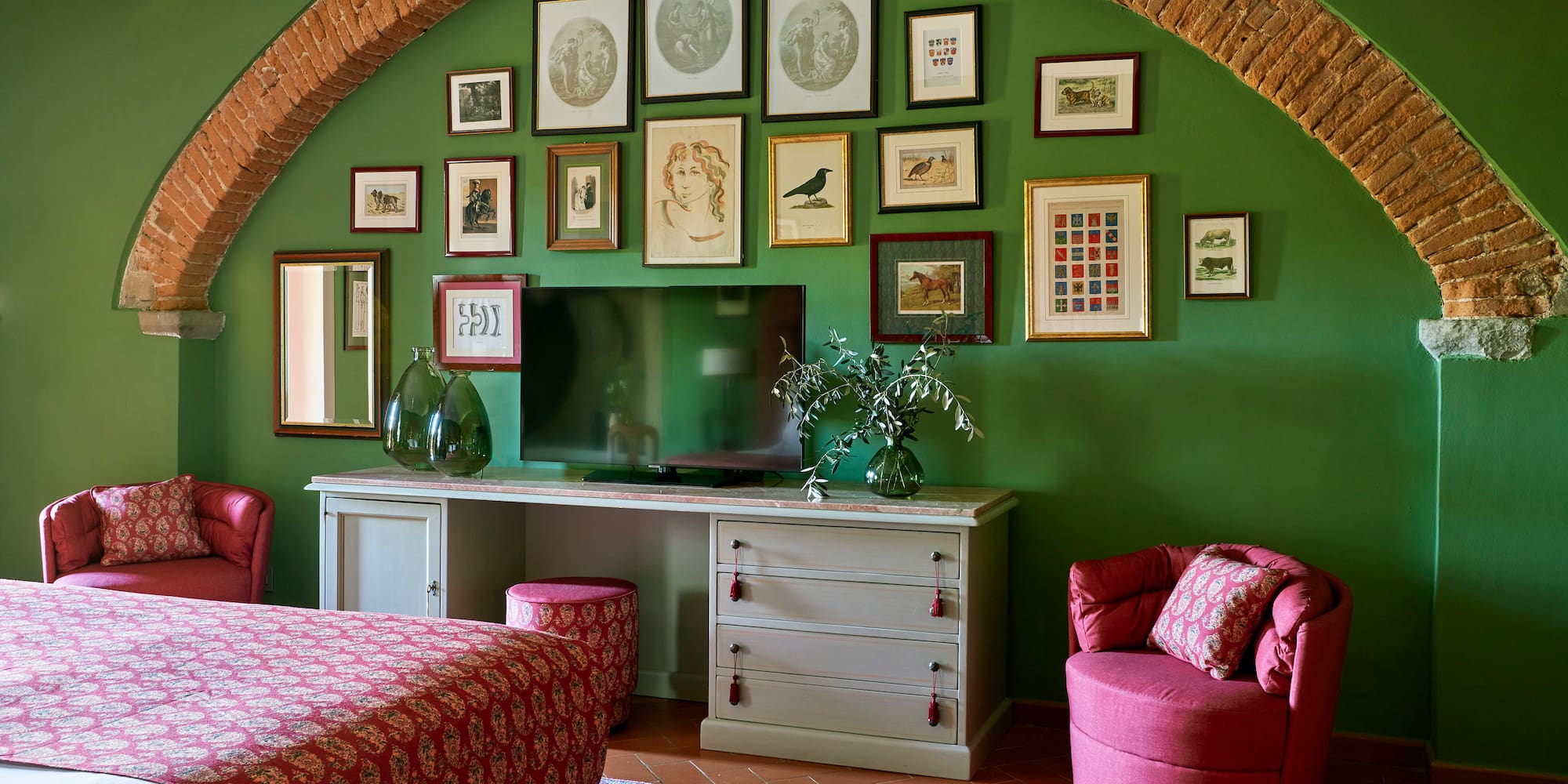 a room with a bed and a television