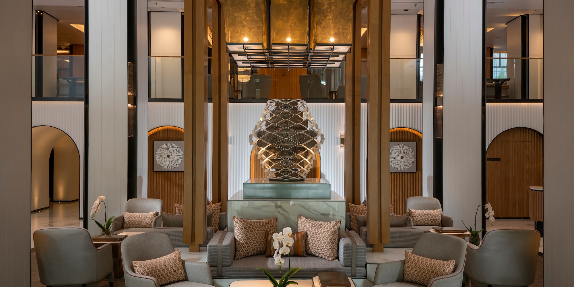 a room with a large glass sculpture in the middle