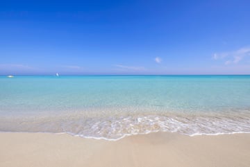 a beach with clear blue water