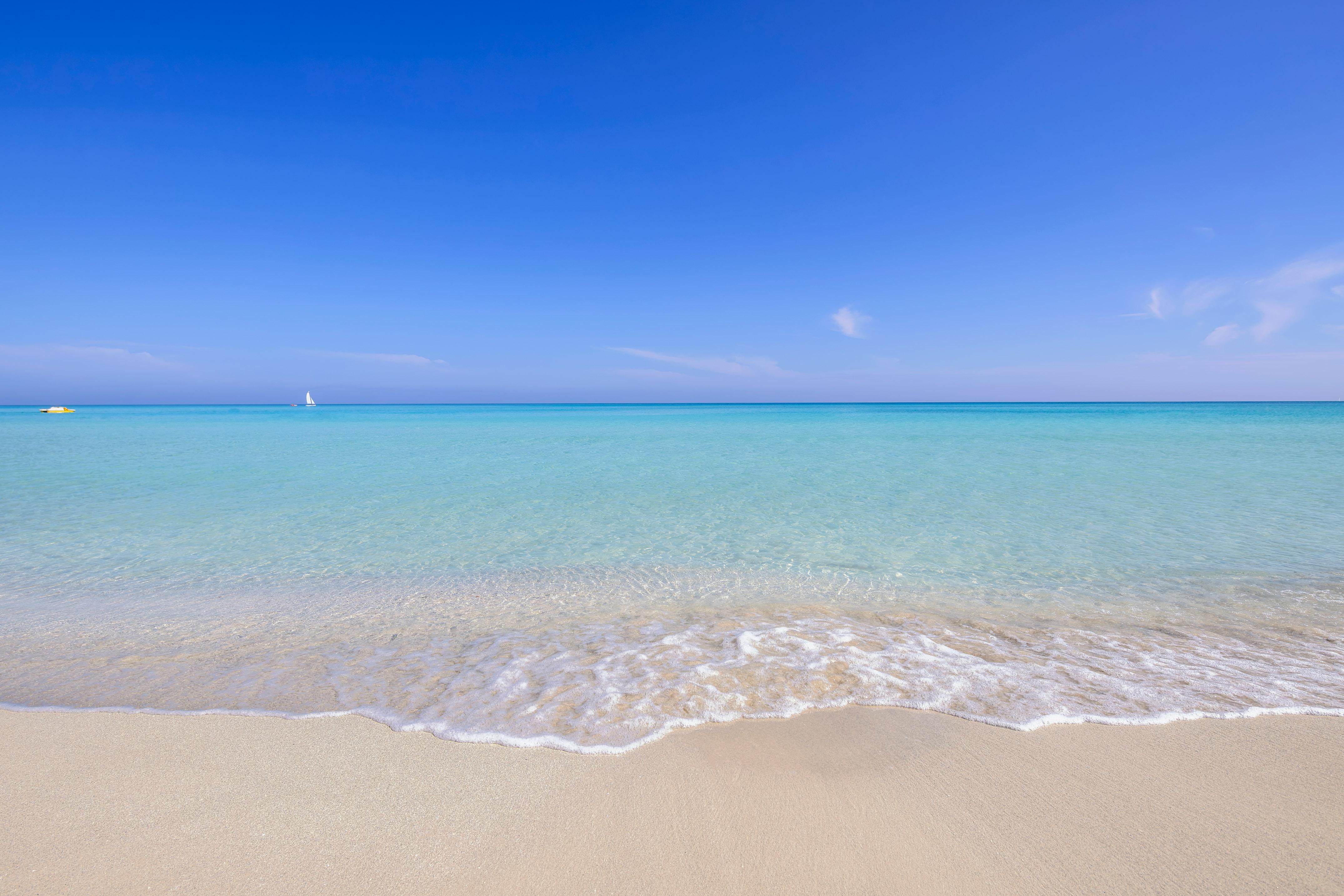 a beach with clear blue water