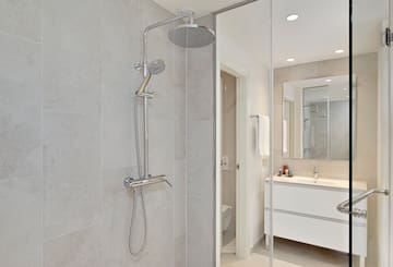 a shower head in a bathroom