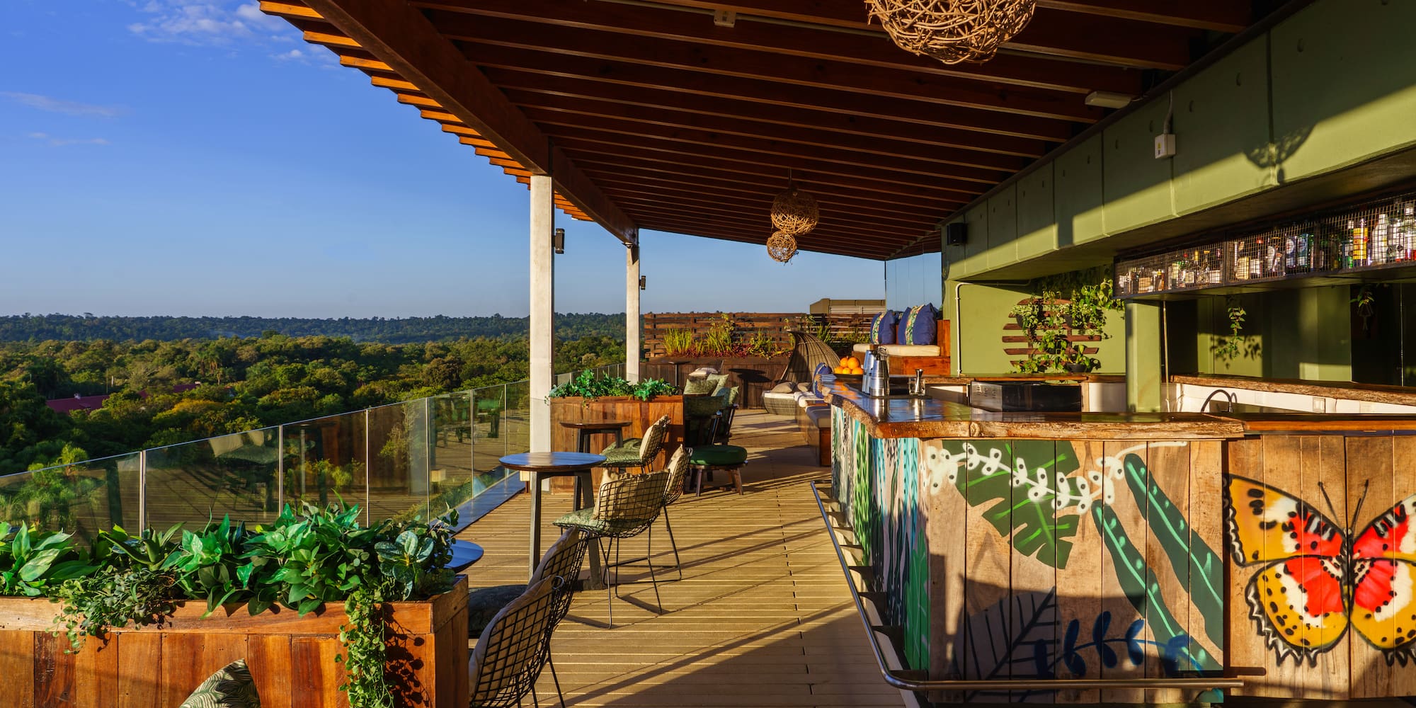 a patio with chairs and tables on a deck