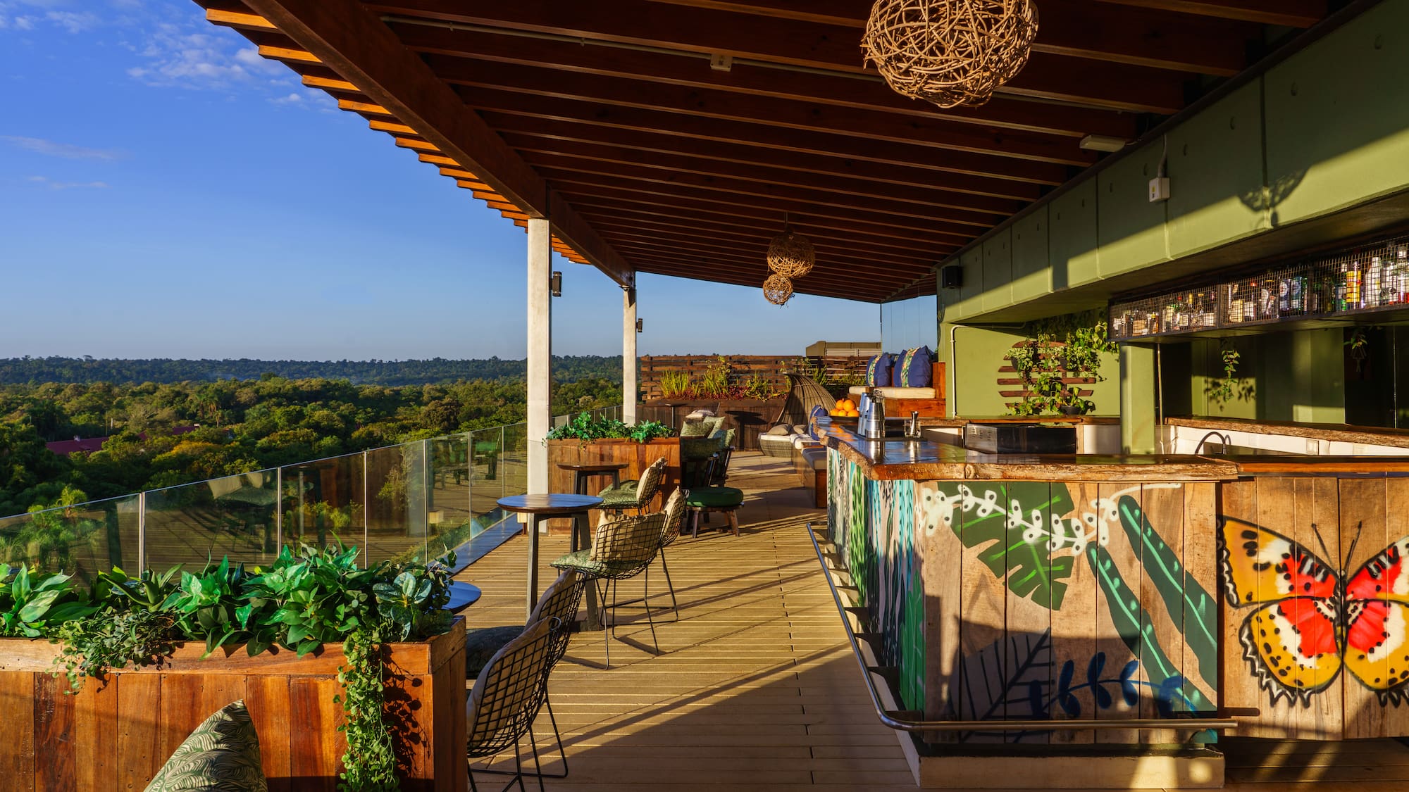 a patio with chairs and tables on a deck