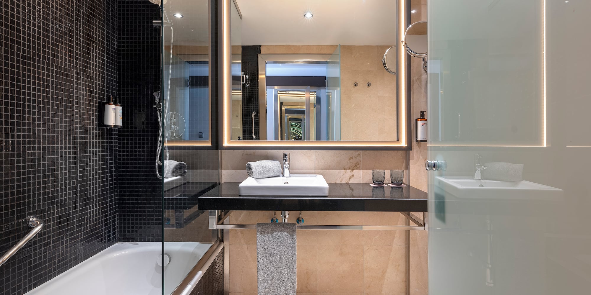 a bathroom with a mirror and a sink
