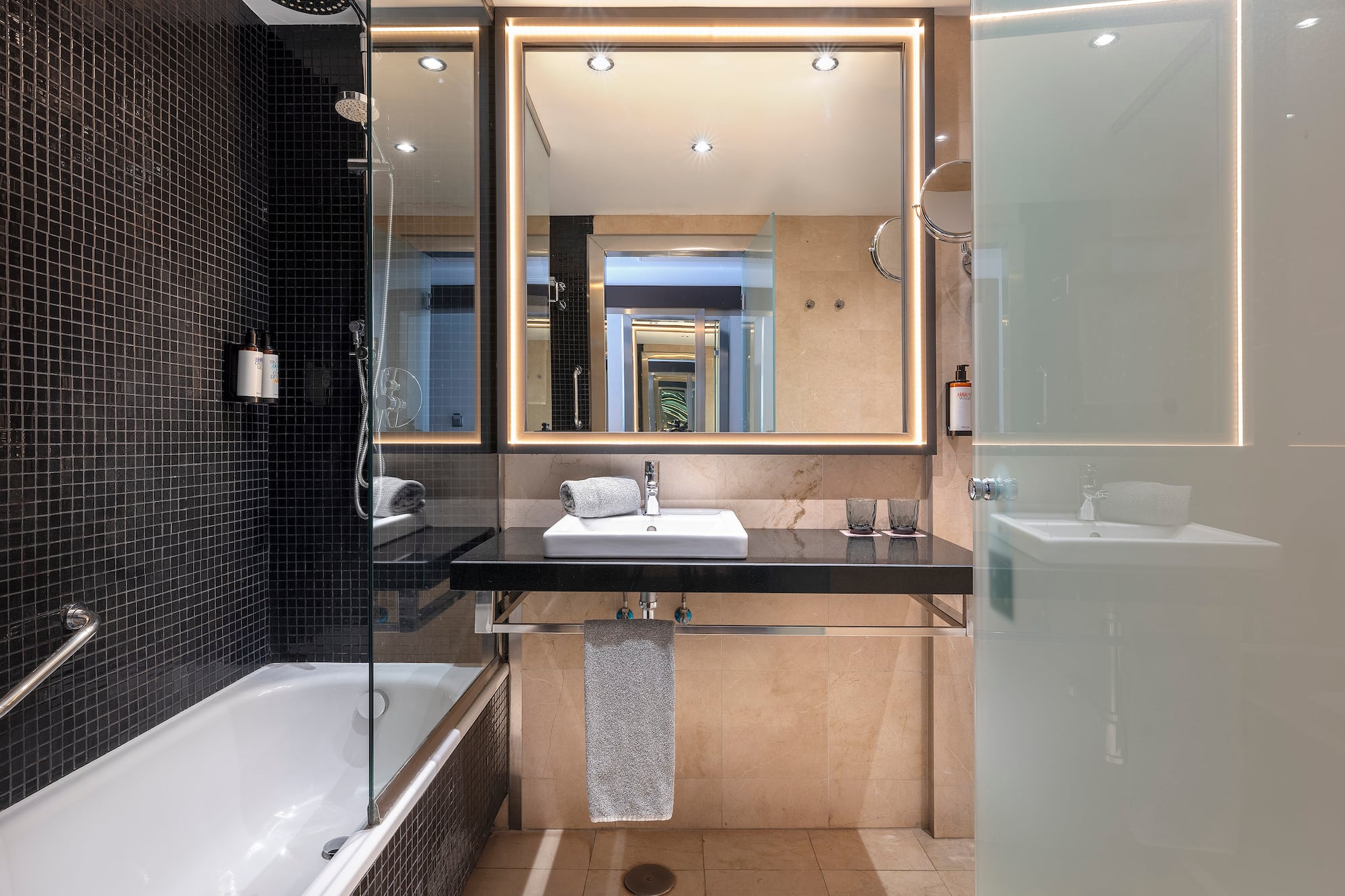 a bathroom with a mirror and a sink