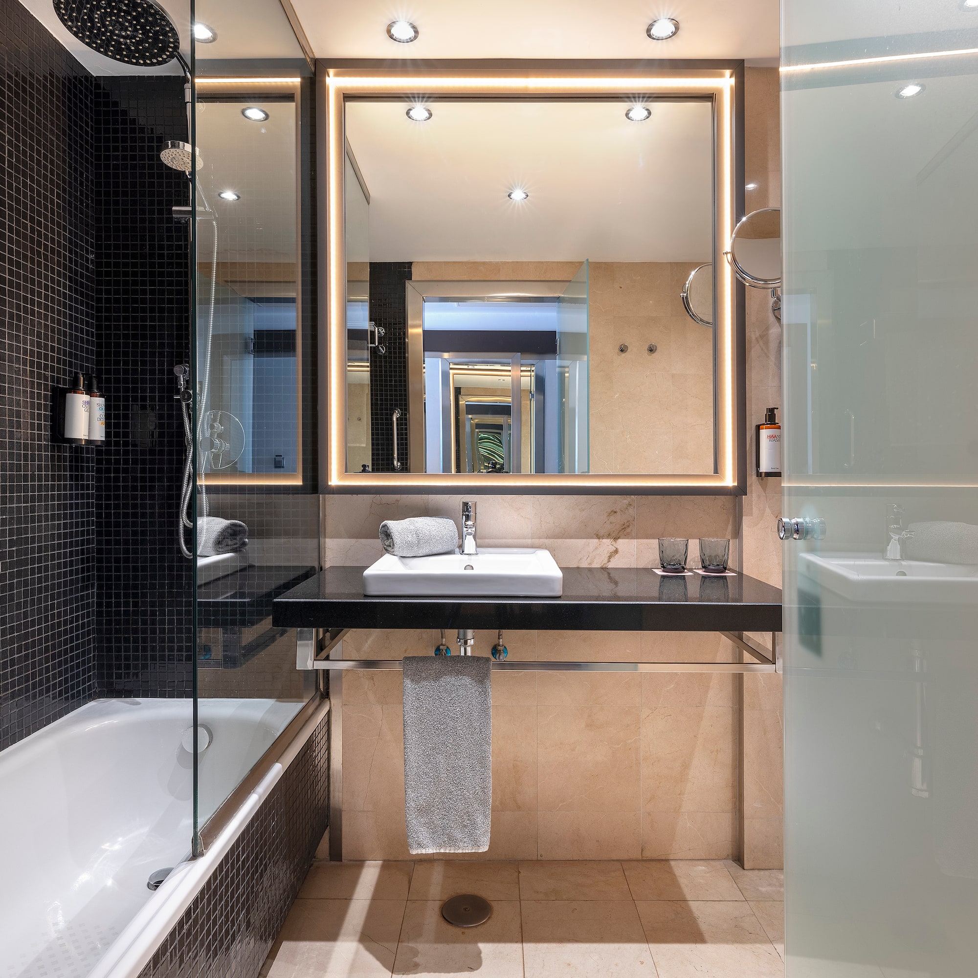 a bathroom with a mirror and a sink