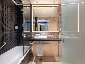 a bathroom with a mirror and a sink