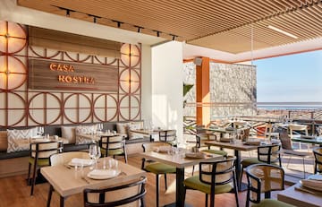 a restaurant with tables and chairs