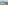 Balcony view of a tropical beach, palm trees, turquoise ocean, and distant island.
