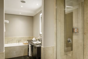 a bathroom with a shower and sink