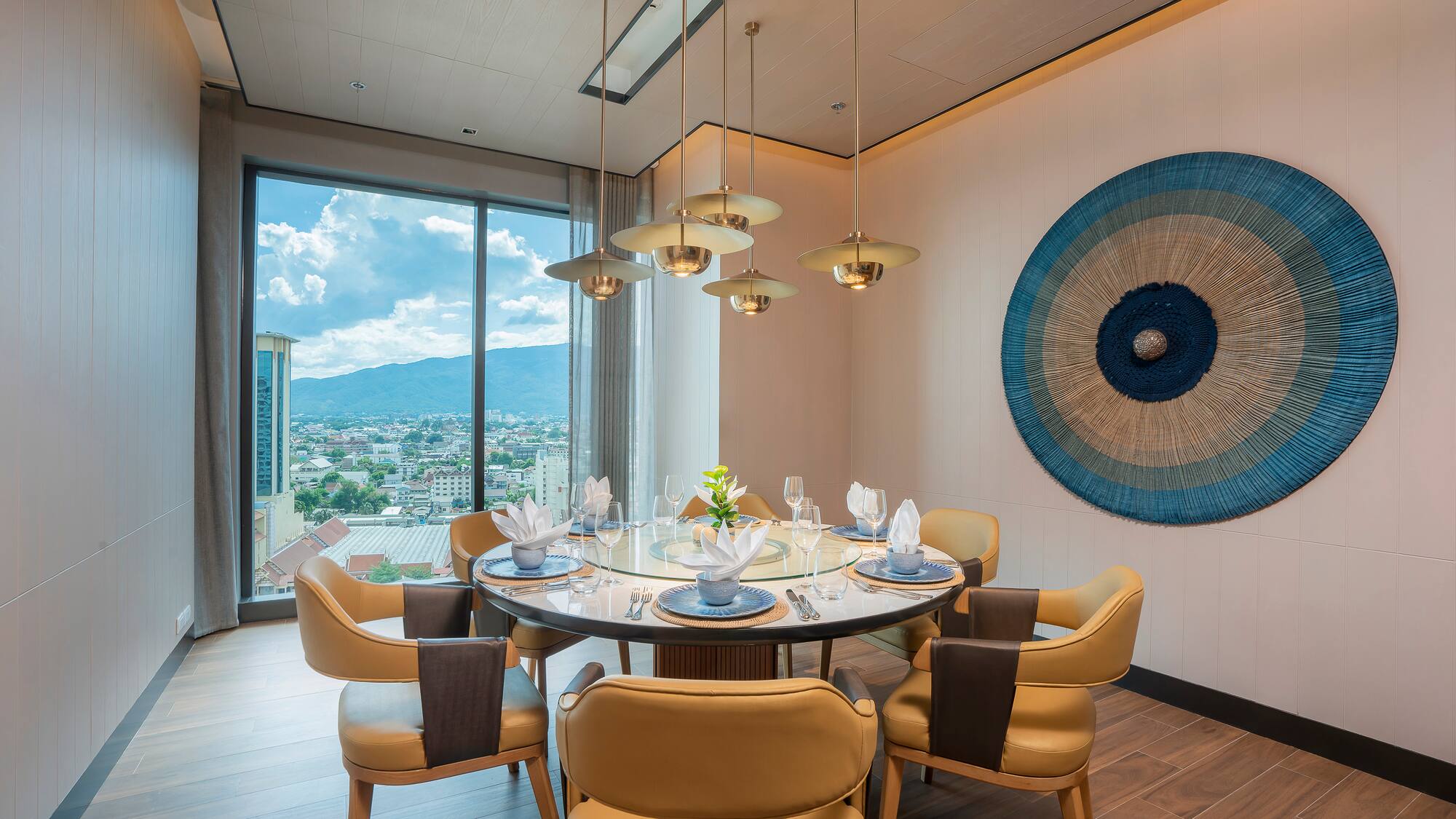 a dining room with a table and chairs
